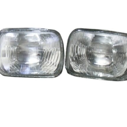Front view of a Suzuki FX sealed beam headlight with a clear fluted glass lens.